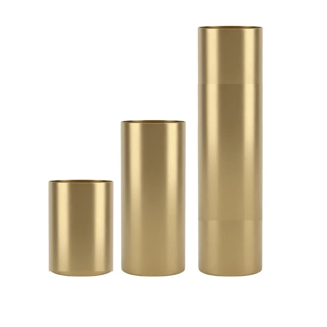 Three brushed brass planters in proportional heights